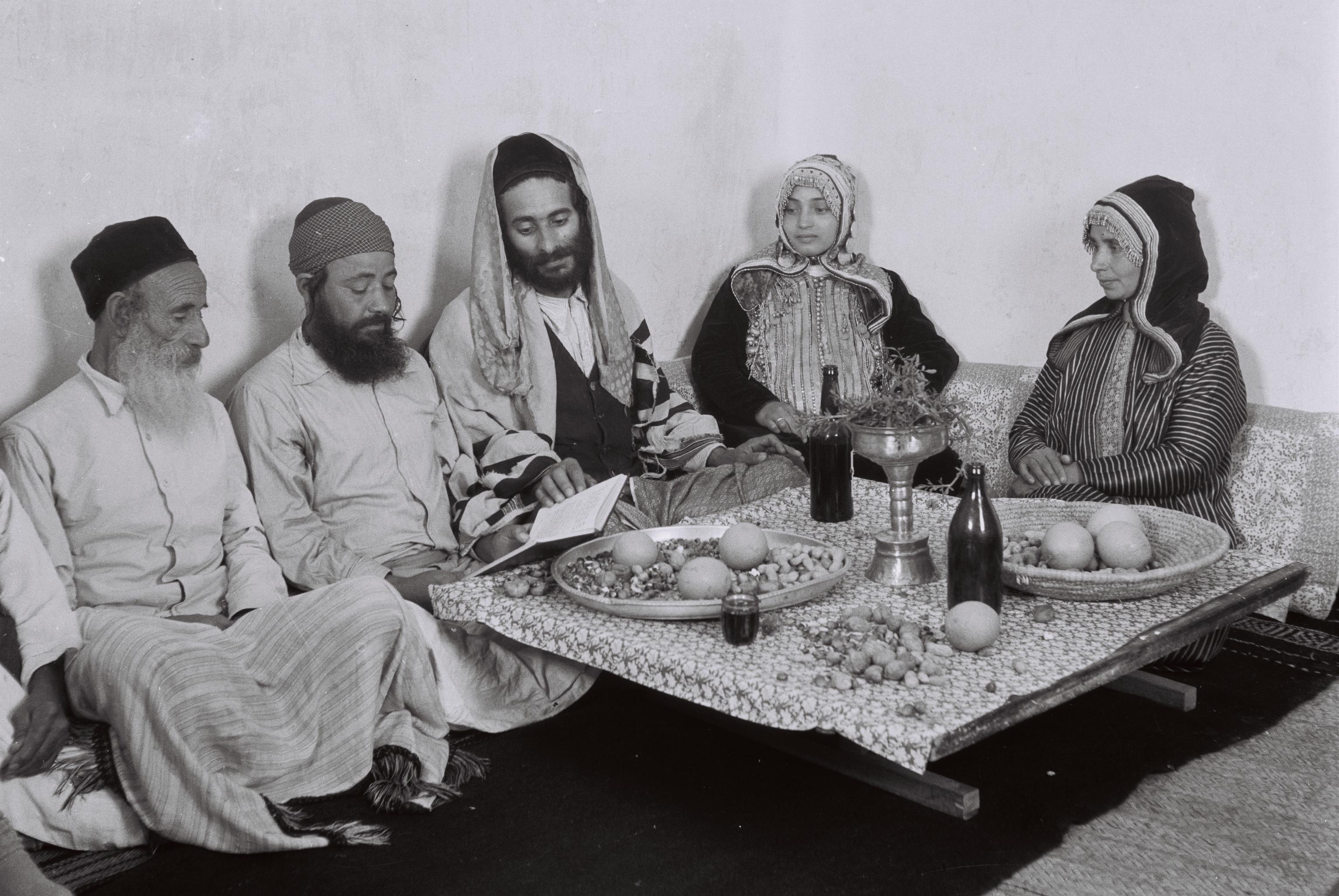 A Jewish family in Yemen gathered around the table reading Psalms. (c) Christian-Julien Robin, President of the Academy of Inscriptions and Belles-lettres (France)