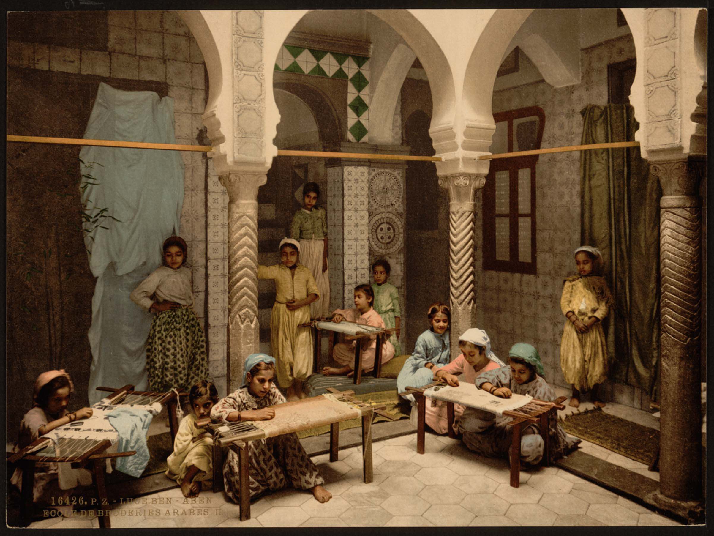 : Vintage postcard illustrated with painting of the Luce Ben Aben School of Arab Embroidery in Algiers, Algeria (1899). (c) Ariella Aïsha Azoulay