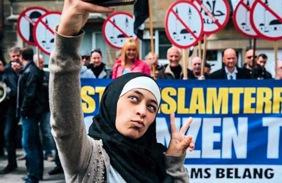Belgian Muslim woman who confronted anti-Islam rally made anti-Semitic posts