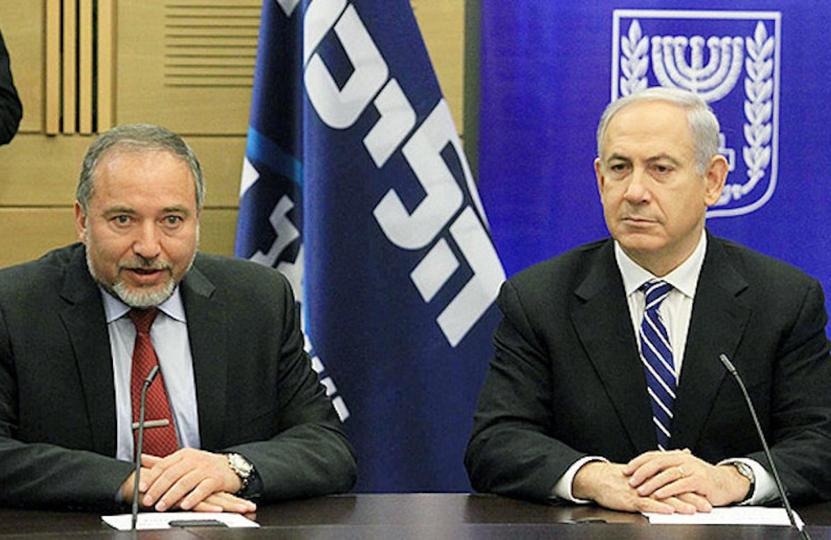 Deal signed to expand Israel's governing coalition / Lieberman to become defense minister